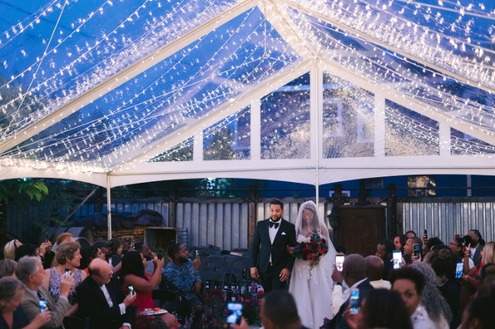 outdoor wedding tent with string lighting