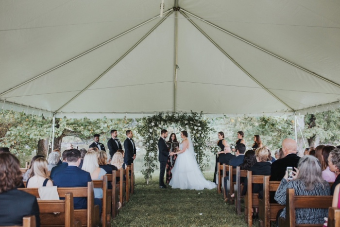 Home wedding under outdoor tent in upstate new york