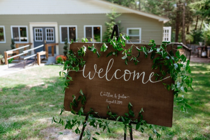 welcome sign in front of home wedding
