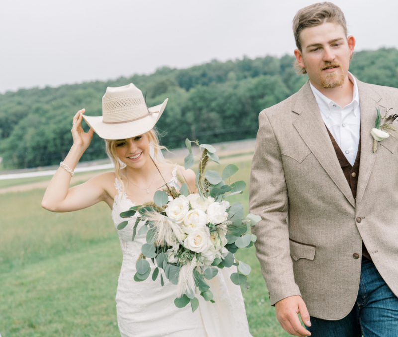 country wedding bride wears cowboy hat