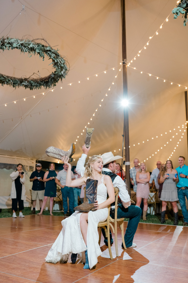 bride and groom play the shoe game
