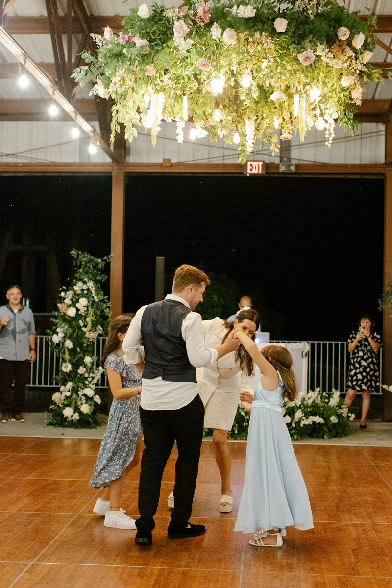 children dancing with the groom