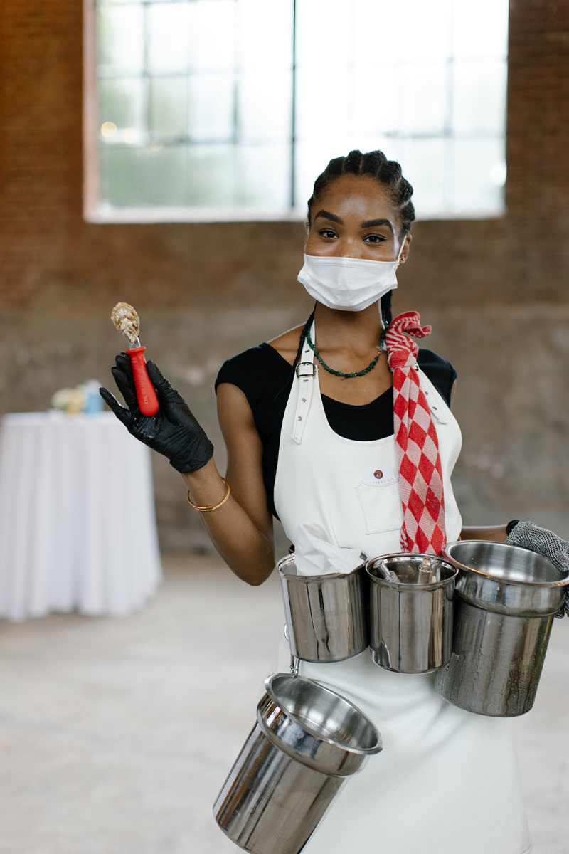 oyster shucks during catering