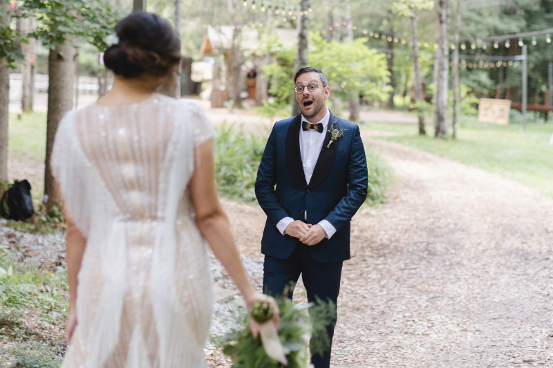 groom sees bride in wedding dress for the first time