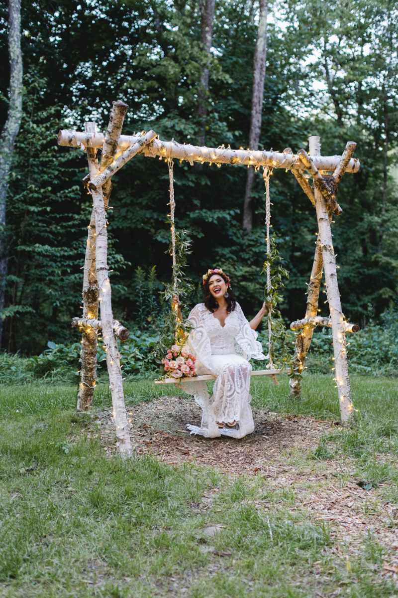 Bride swinging on swing at Hudson Valley wedding venue