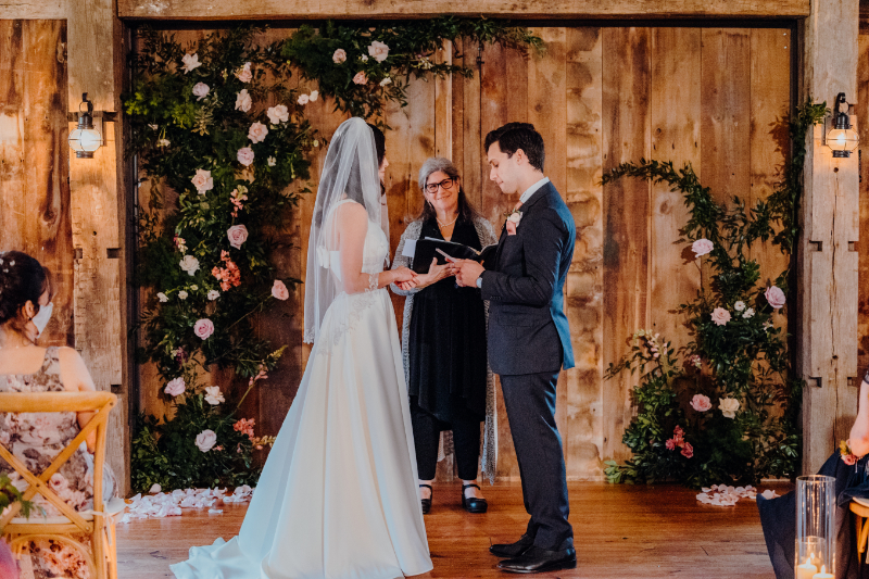 bride and groom stand solo