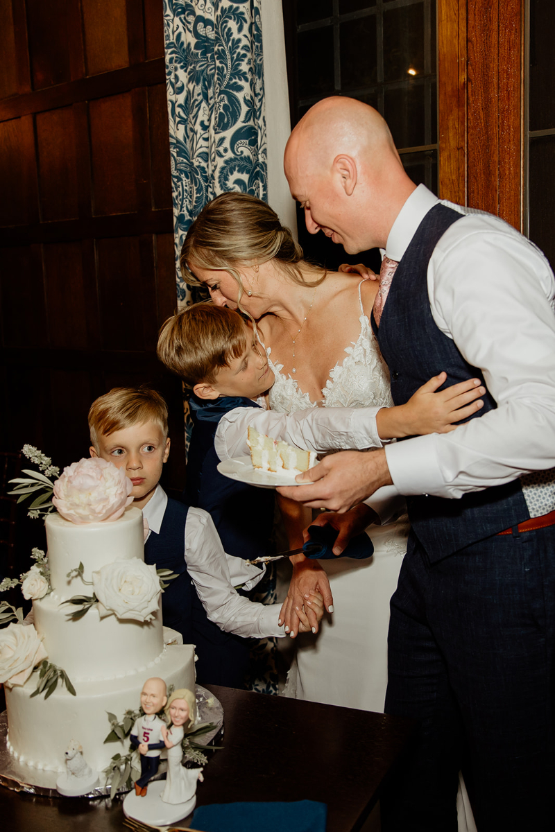 bride and groom cut their wedding cake