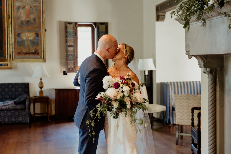 bride and groom kiss