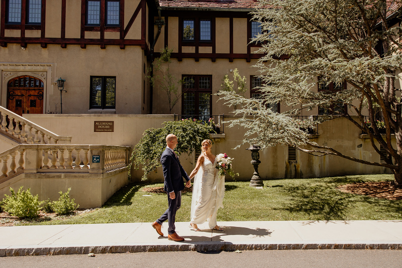 bride and groom walk around Vassar College campus