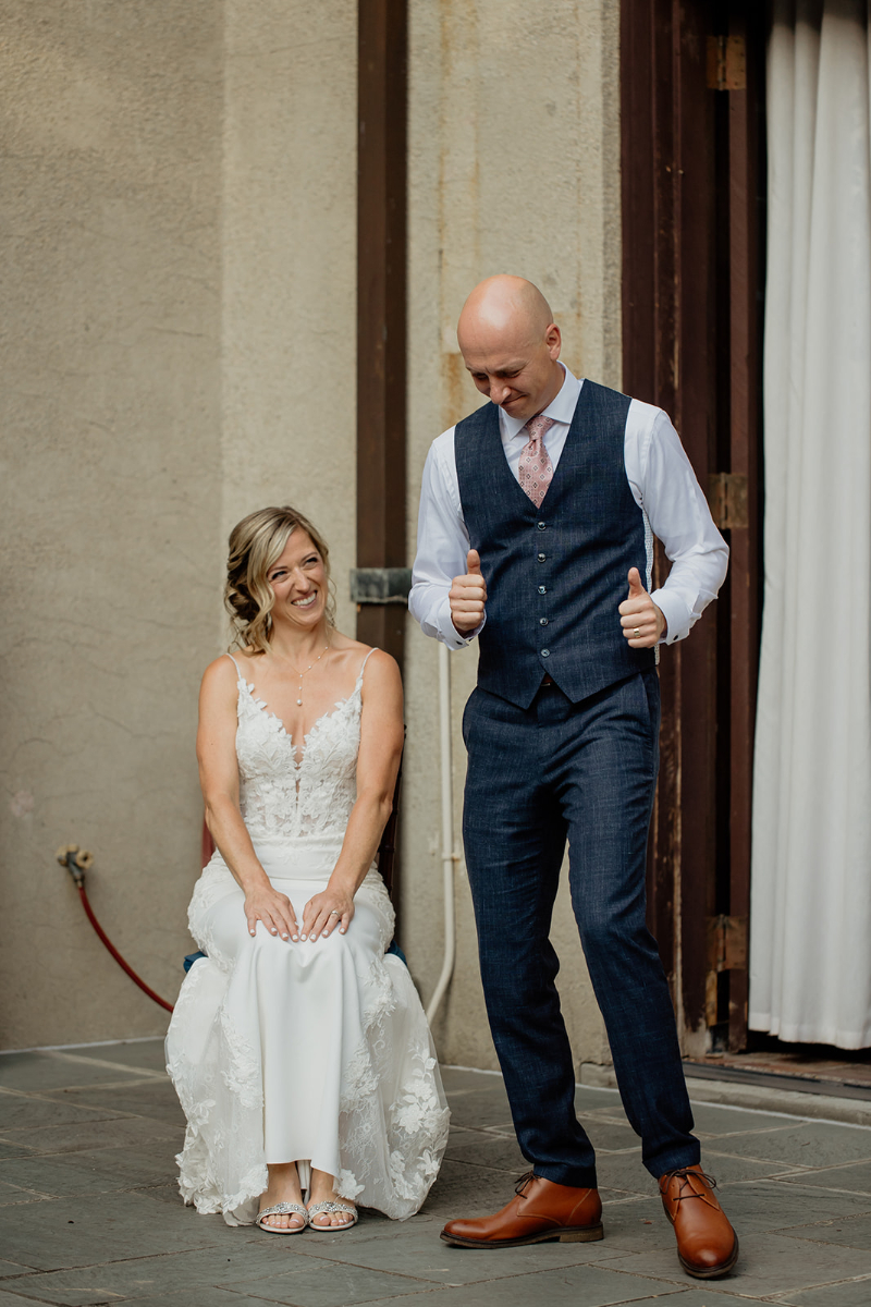 groom performs song and dance for bride during wedding at Vassar College
