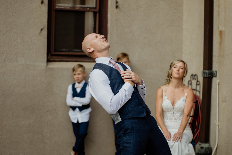 groom performs song and dance for bride during wedding at Vassar College