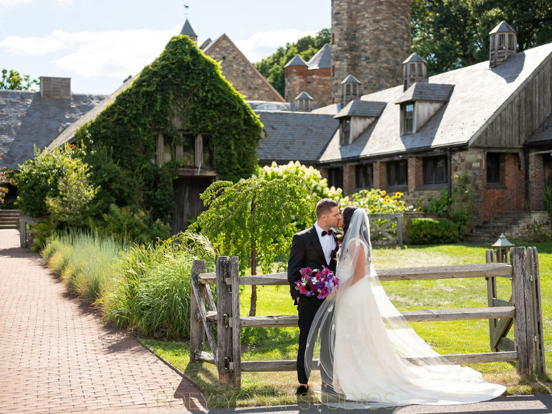 bride and groom kiss at wedding at Blue Hill at Stone Barns