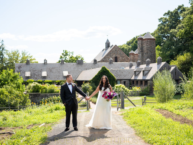 wedding couple walking away from wedding at Blue Hill at Stone Barns