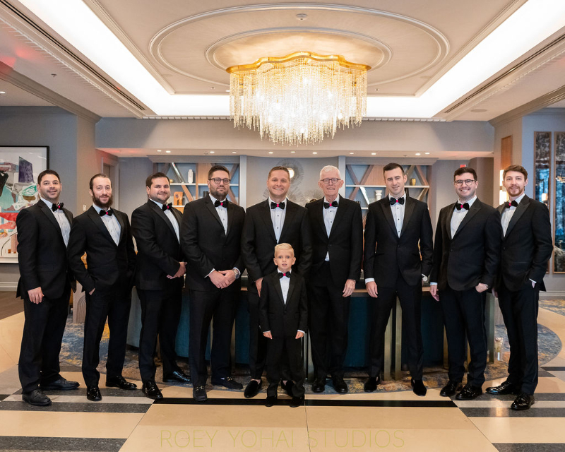 groom posing with groomsmen