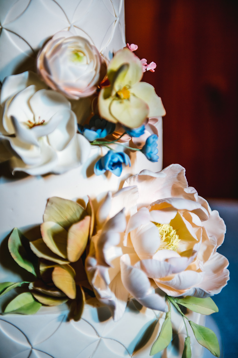 closeup of flowers on the wedding cake