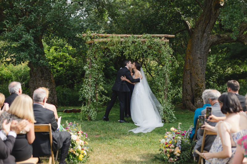 bride and groom first kiss