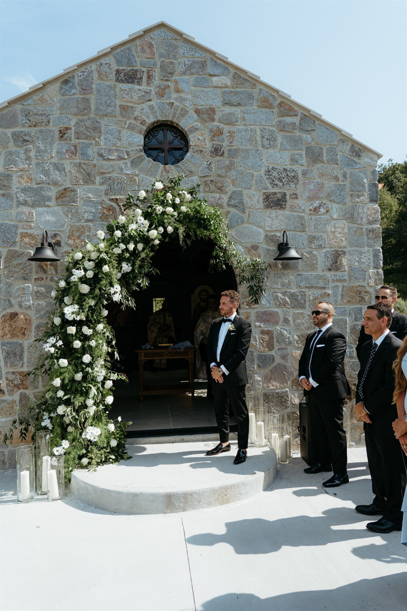 groom waits outside church for bride