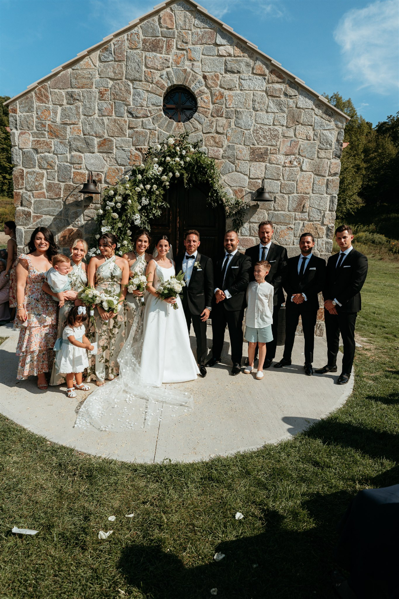 group wedding photo outside chapel