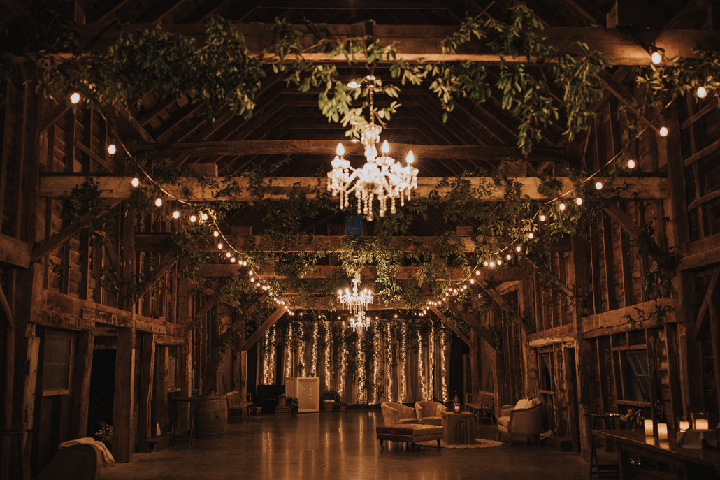 Stunning barn wedding with greenery and chandeliers in upstate new york