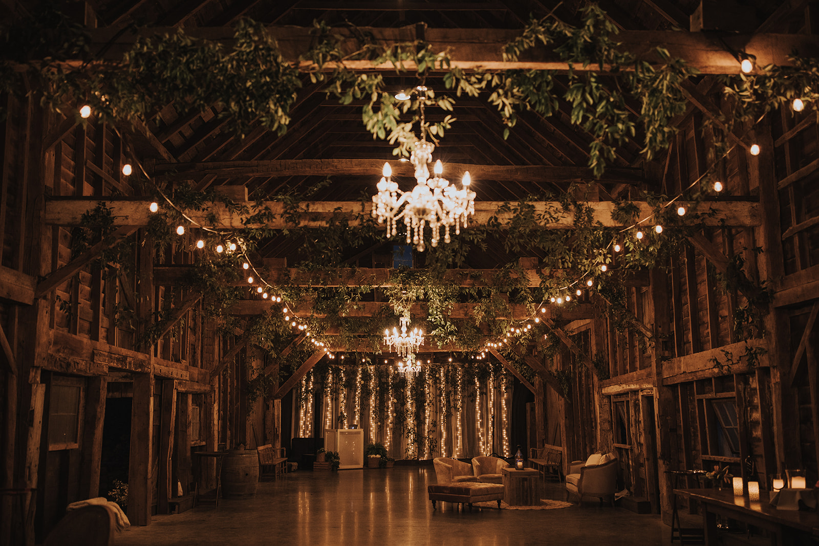 Stunning barn wedding with greenery and chandeliers in upstate new york
