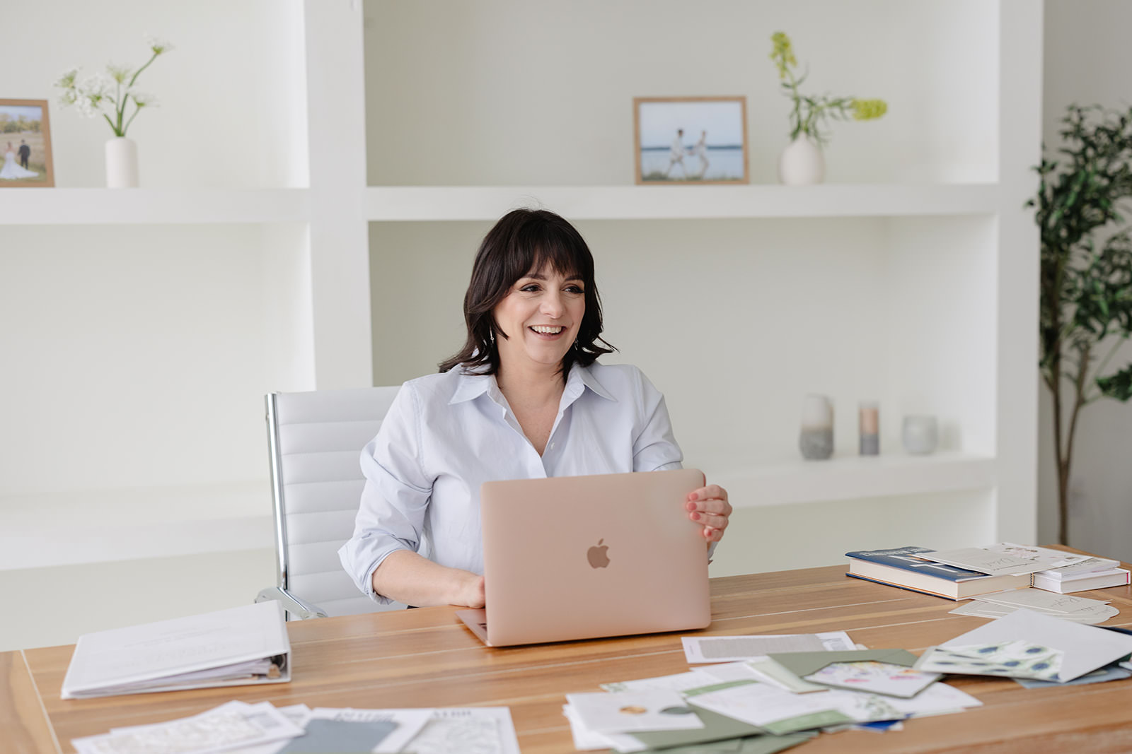 Image of Angela, Luxury Destination Wedding Planner, working on her laptop