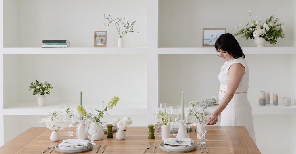 Image of Angela, wedding planner, organizing a table