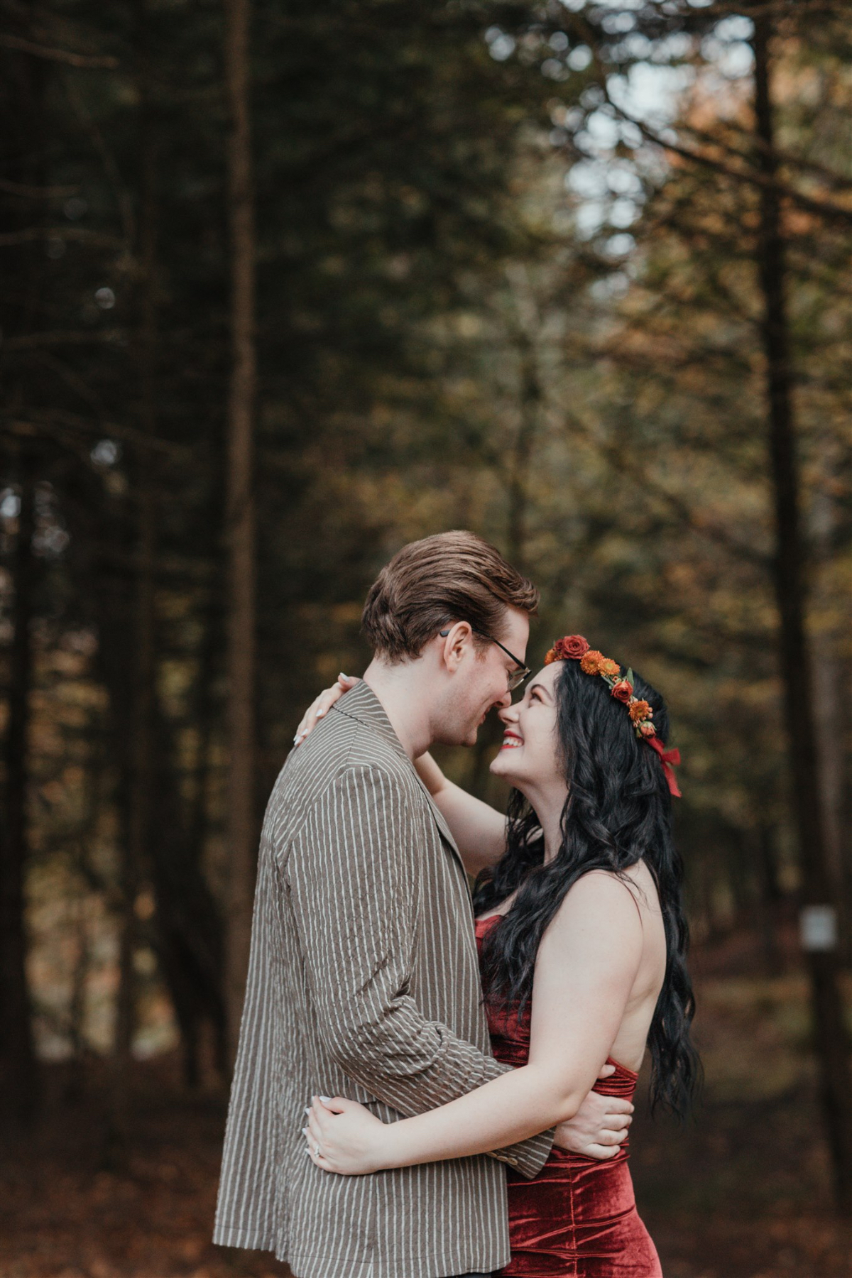 couple shares an intimate moment outside barn