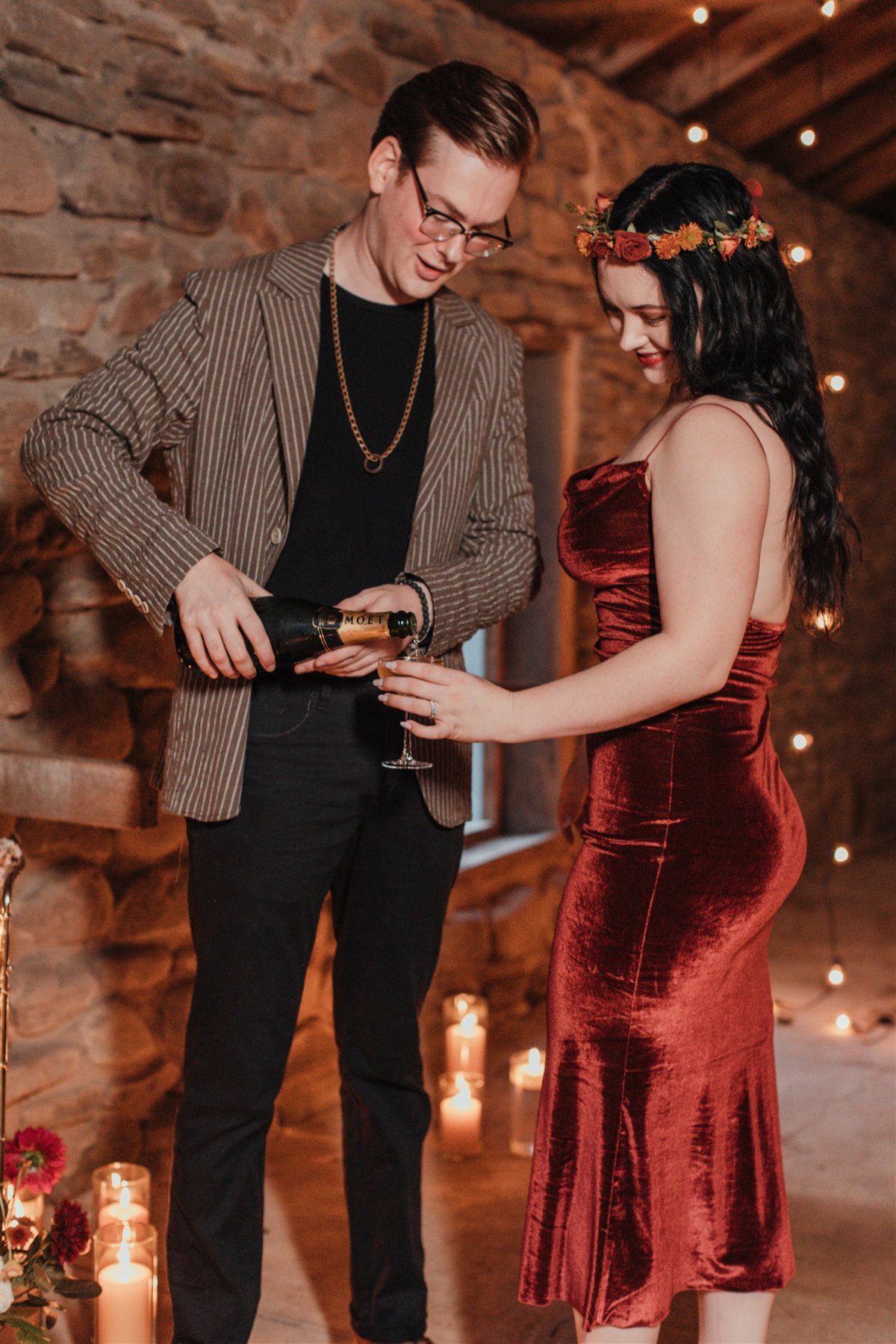 The couple shares a toast during their romantic rehearsal dinner.