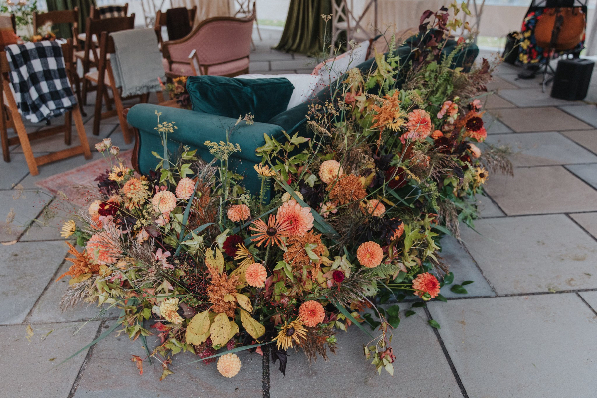 Rustic fall flowers arranged beautifully around the ceremony space, creating a natural, romantic atmosphere.