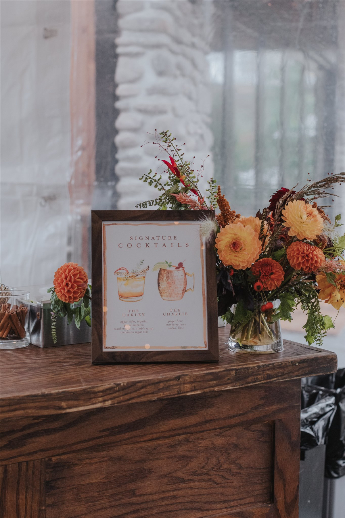 Cocktail sign with rustic accents, welcoming guests to enjoy drinks after the ceremony.