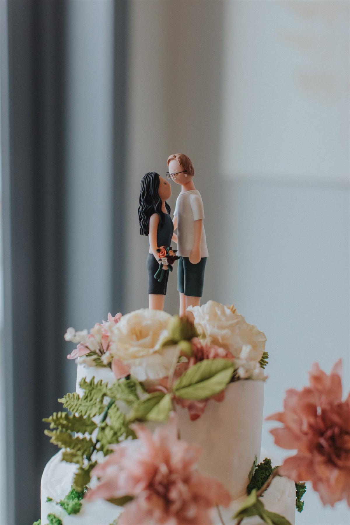 Adorable custom cake toppers of the bride and groom