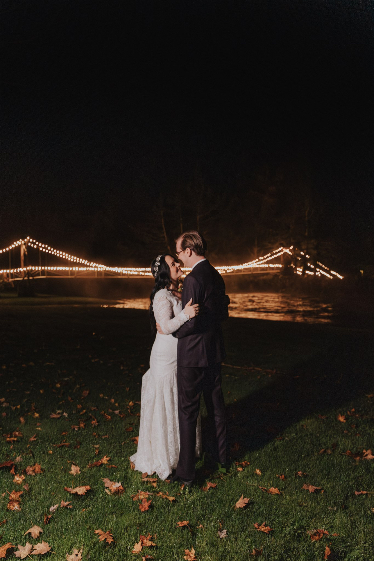 Emily and Greg taking romantic nighttime photos under the stars