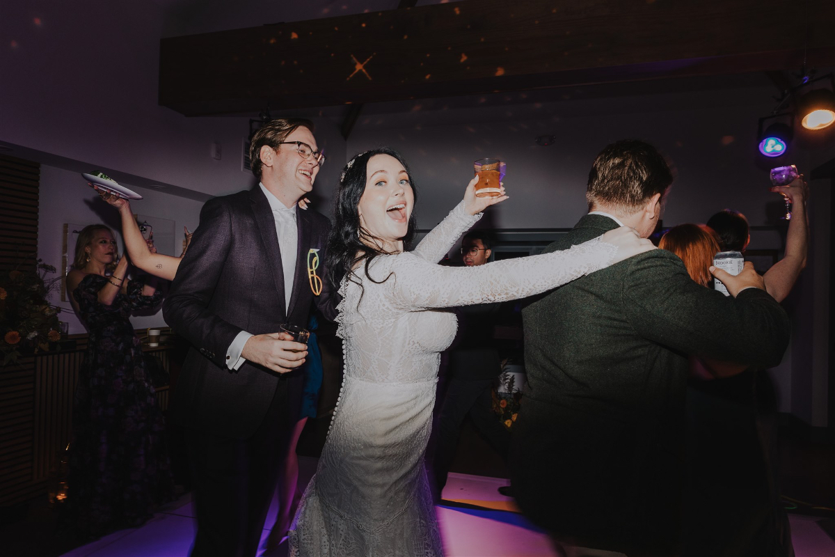 the couple having fun on the dance floor 