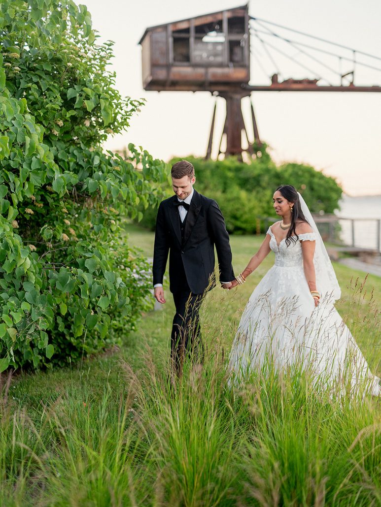 bride and groom walking hand in hand