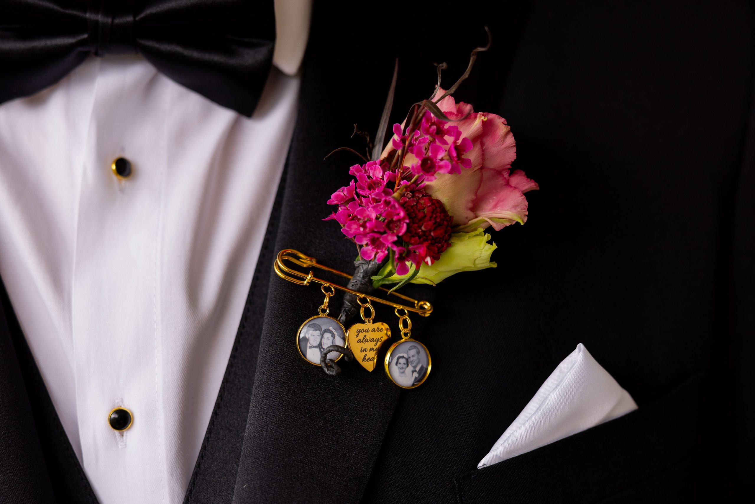 floral boutonniere details on the groom