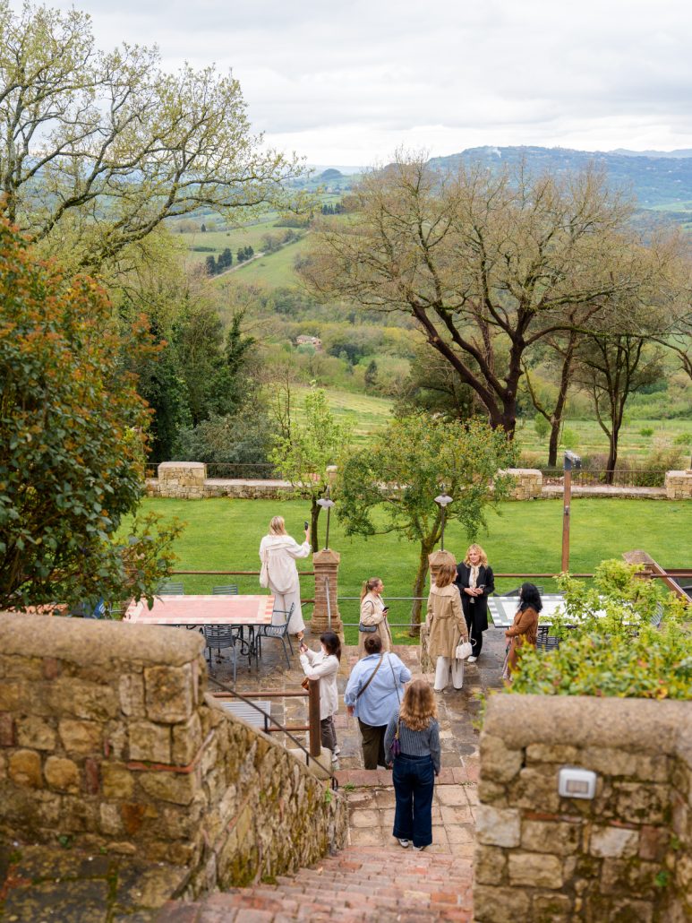 Wedding planners touring the grounds of Borgo Pignano, capturing the beauty of this exclusive Tuscan wedding venue.