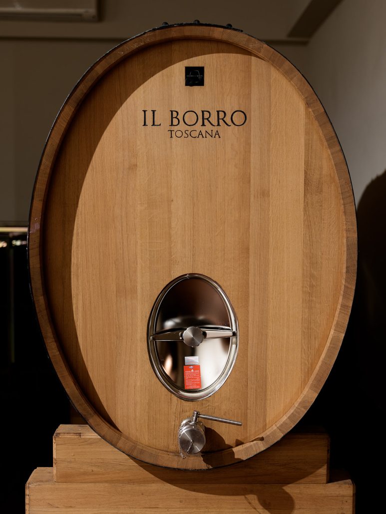Large oak barrel marked “Il Borro Toscana,” showcasing the estate’s winemaking heritage and charm as a Tuscan wedding venue.