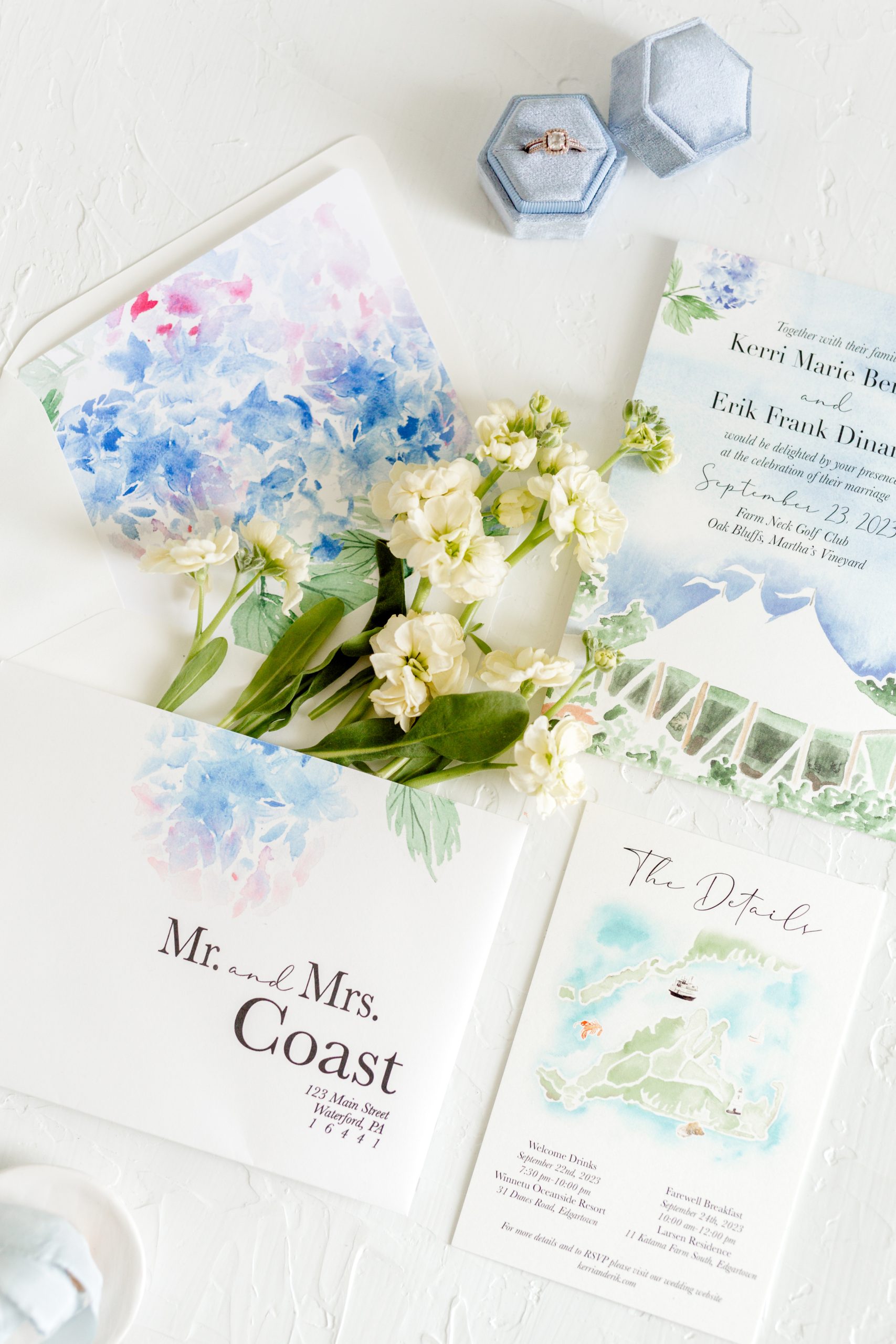 Watercolor hydrangea wedding invitation suite styled with white flowers and velvet ring box, perfect for mailing wedding invitations with a romantic touch.