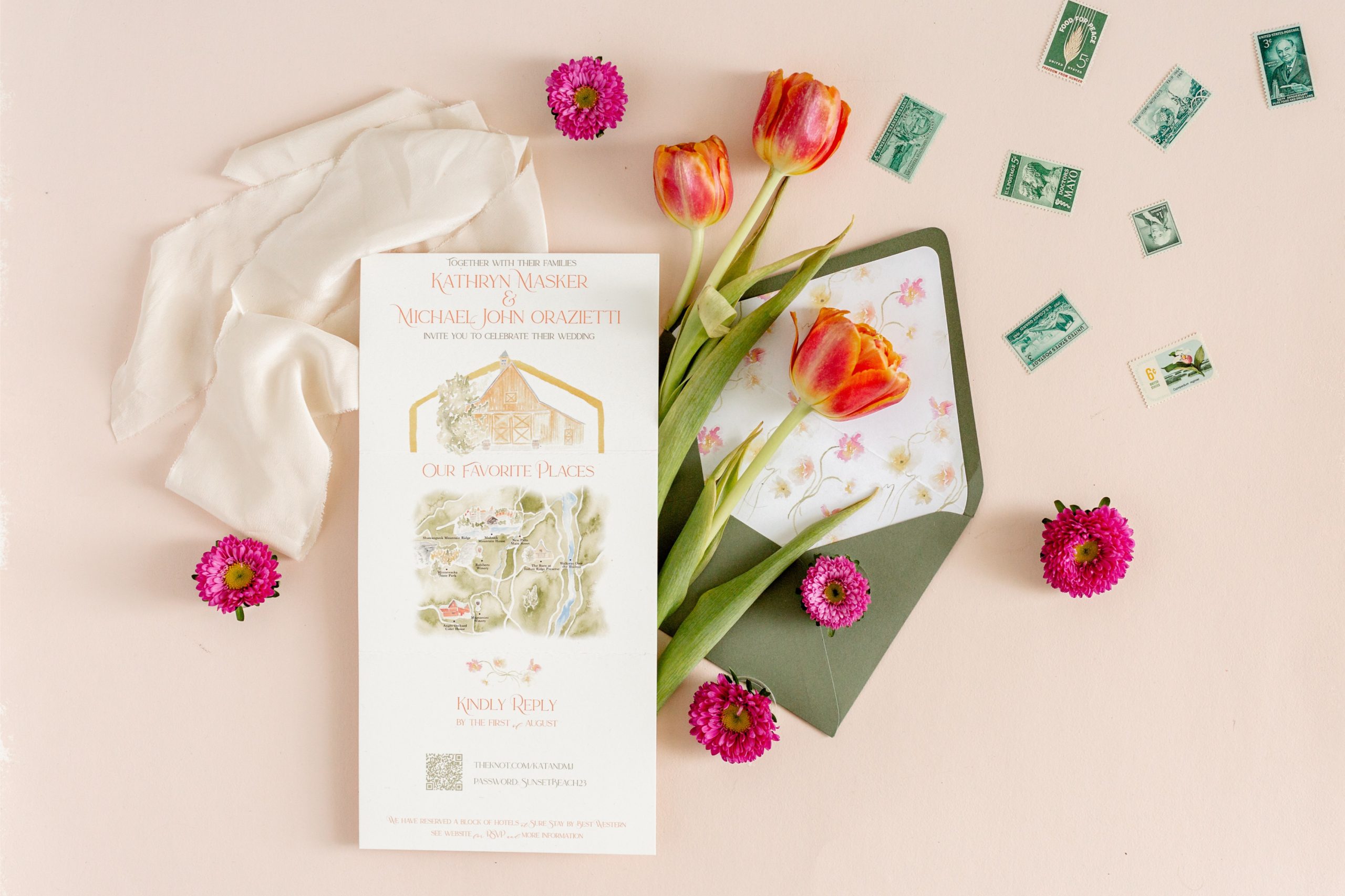 Mailing wedding invitations styled with tulips, vintage stamps, and a hand-illustrated barn wedding invite design.