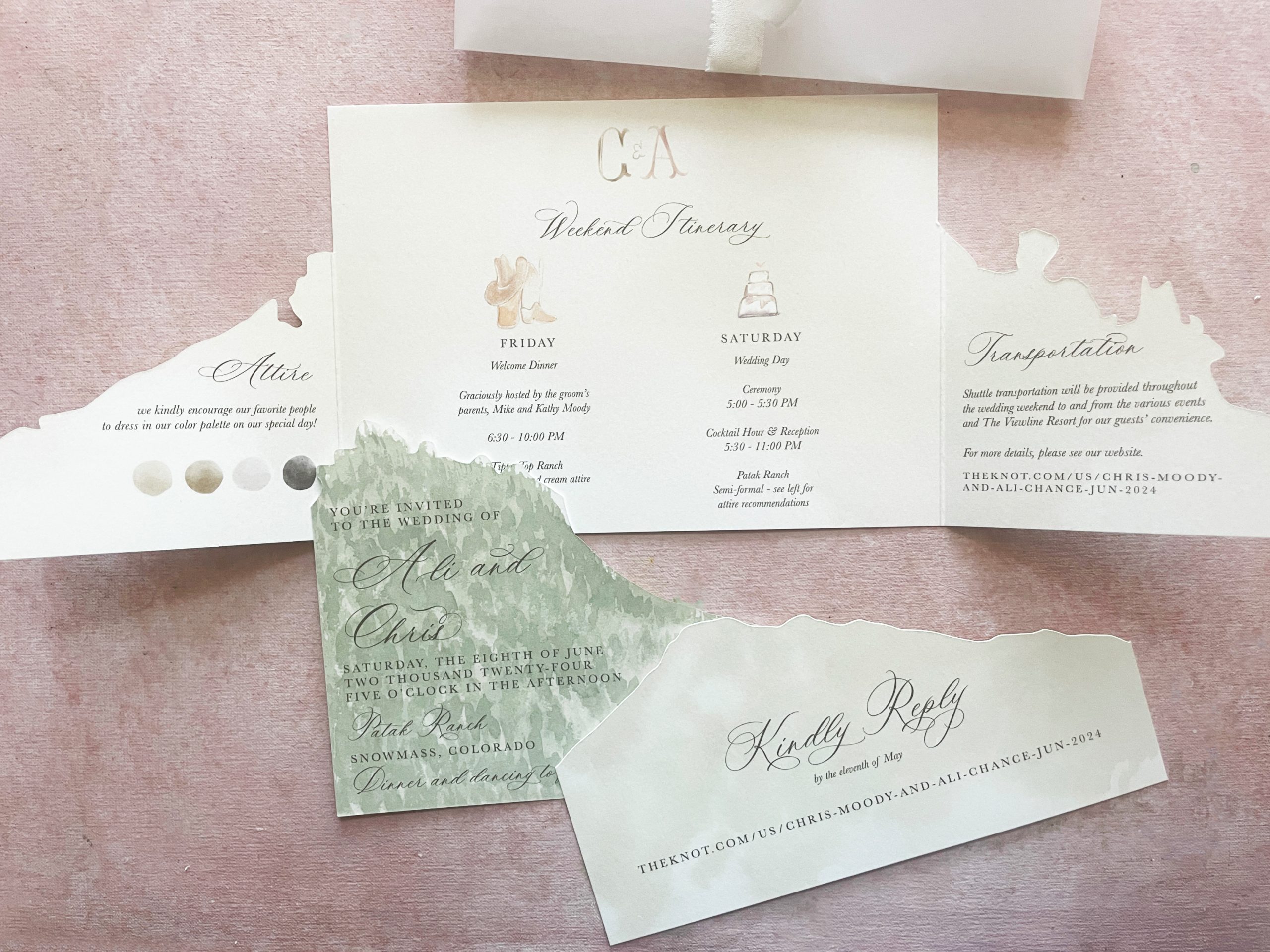 Mailing wedding invitations featuring a custom watercolor landscape, elegant typography, and weekend itinerary.