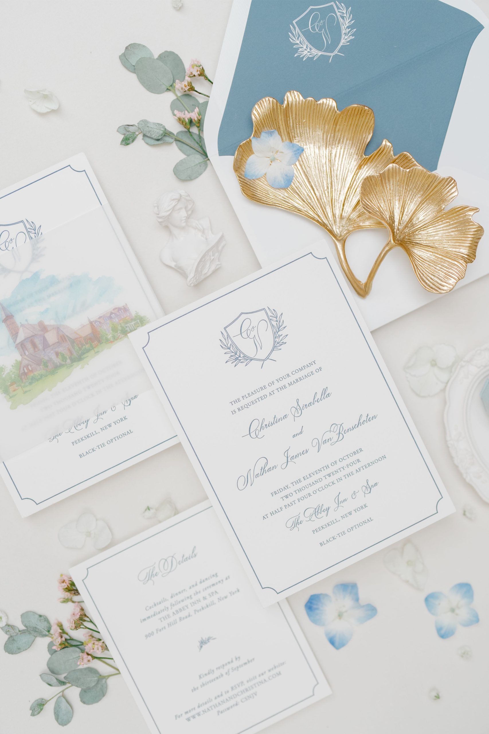 A luxury wedding invitation suite featuring navy envelope liners, blue florals, and gold details—ideal for mailing wedding invitations with sophistication.
