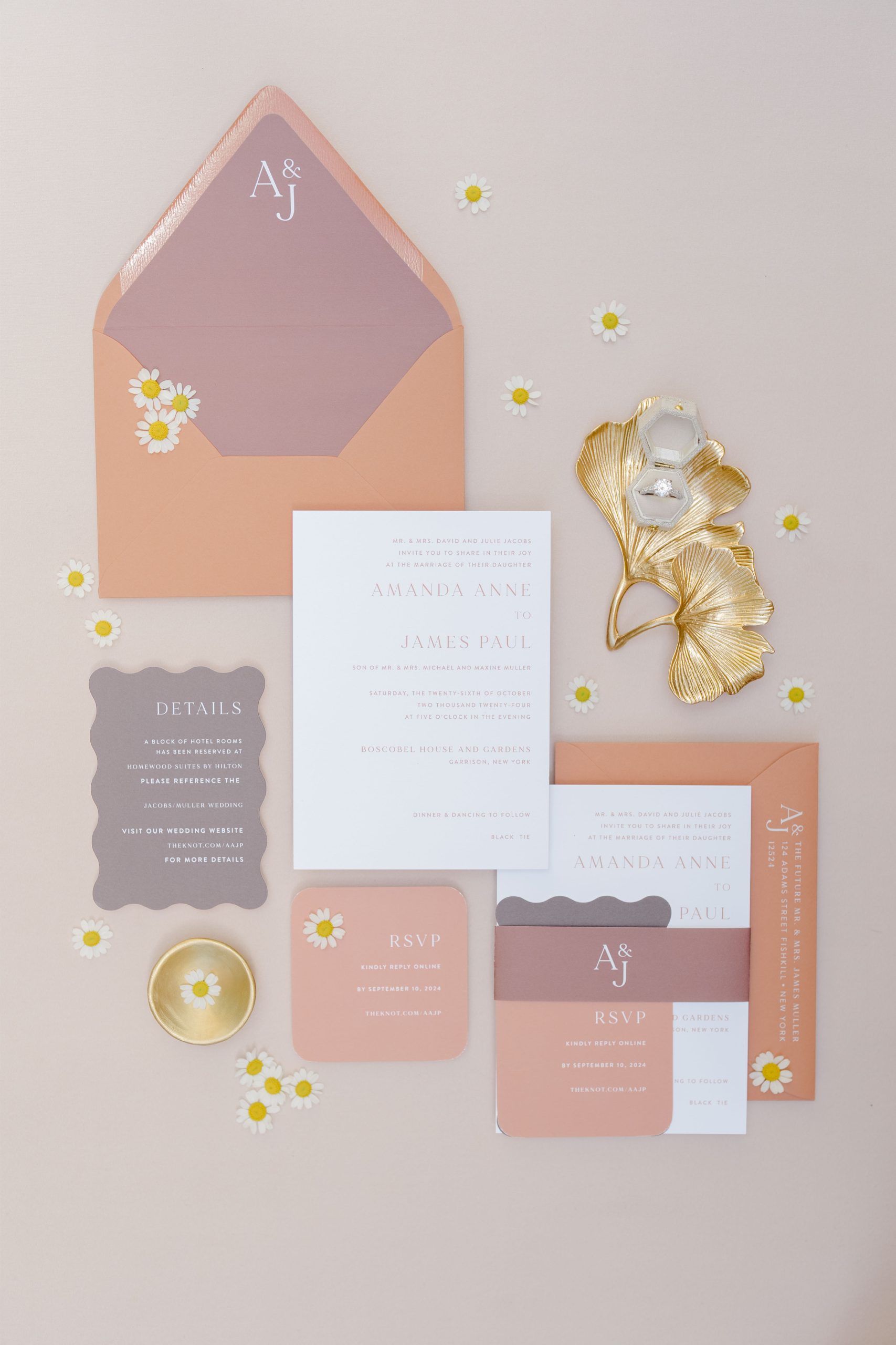A romantic wedding invitation suite with peach and mauve tones, ready for mailing to guests with personalized elegance.