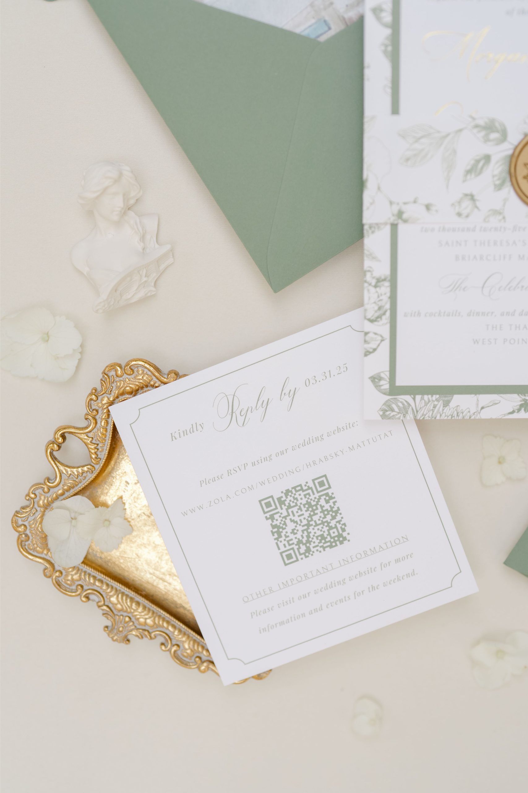 A printed RSVP card with QR code resting in a gold tray, blending digital convenience with the tradition of mailing wedding invitations.