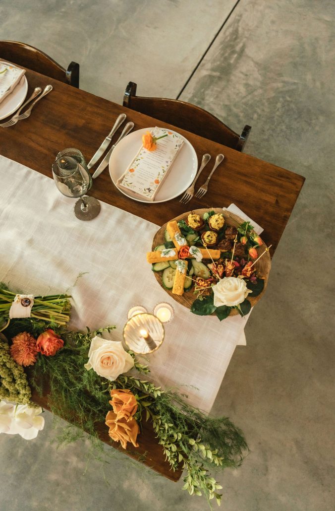A refined tablescape with linen textures, seasonal flowers, and beautifully plated dishes.