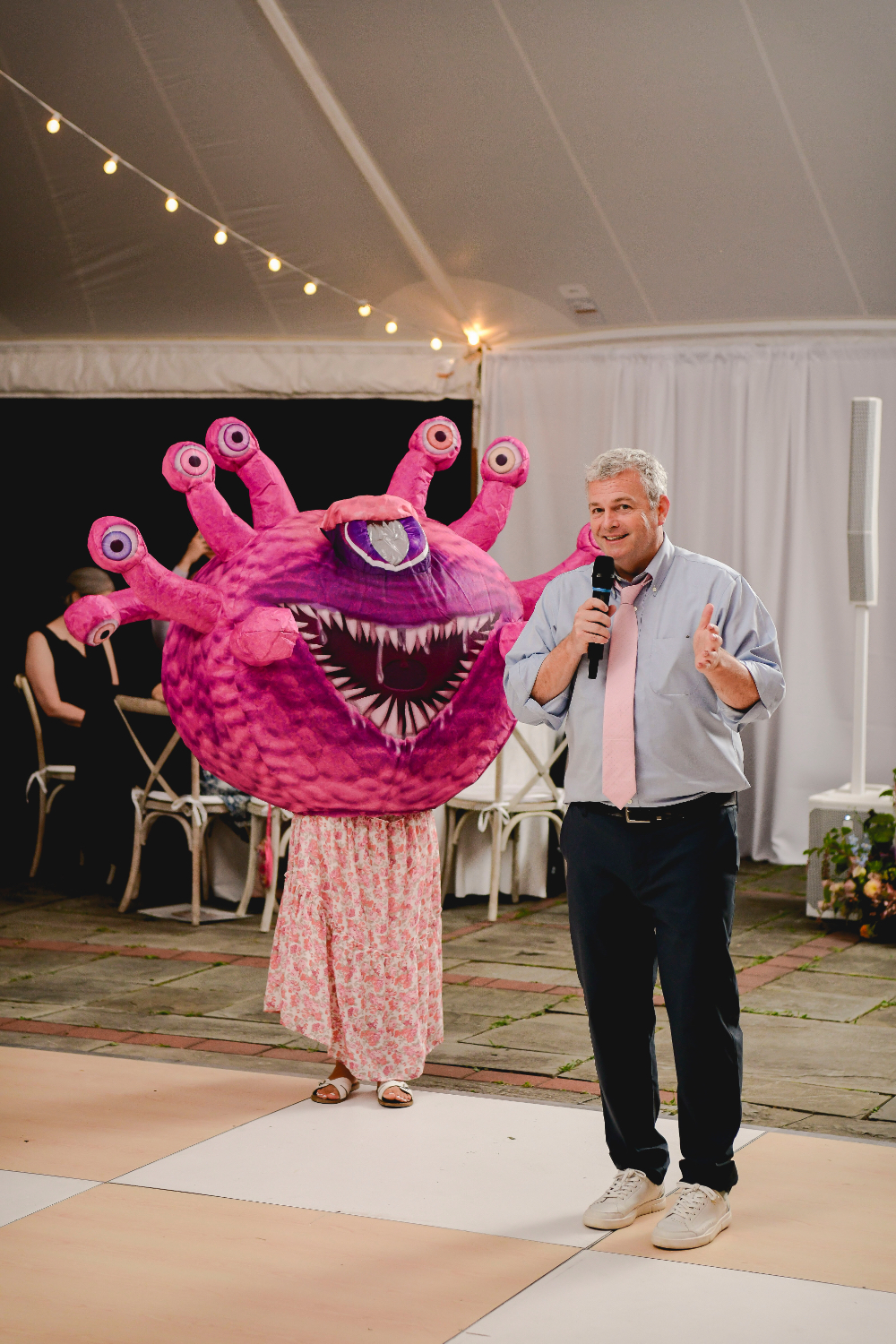 Emotional wedding speech given under the tent at the Buttermilk Falls Inn wedding. pink monster