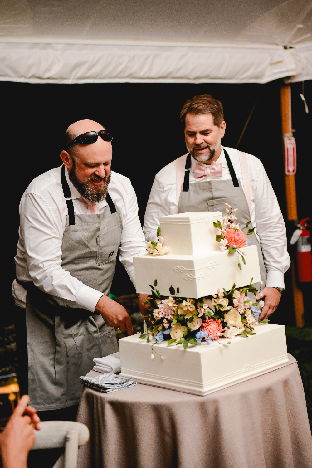 The custom wedding cake decorated with sugar flowers at the Buttermilk Falls Inn wedding.