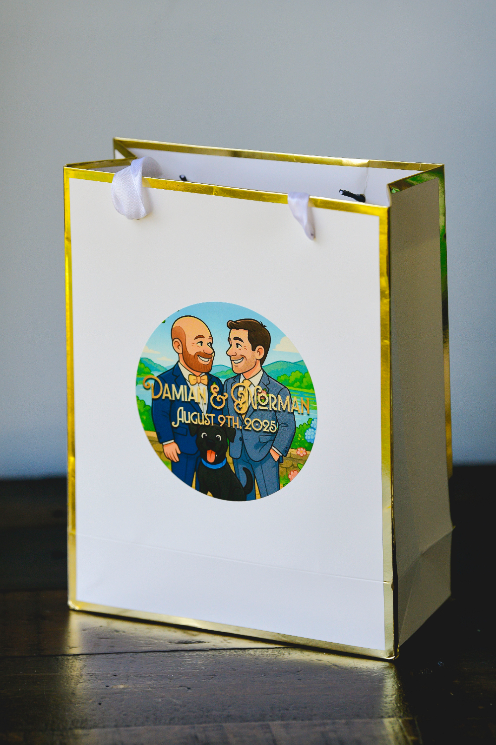 A custom wedding welcome bag featuring an illustrated portrait of the grooms for their Buttermilk Falls Inn wedding weekend.