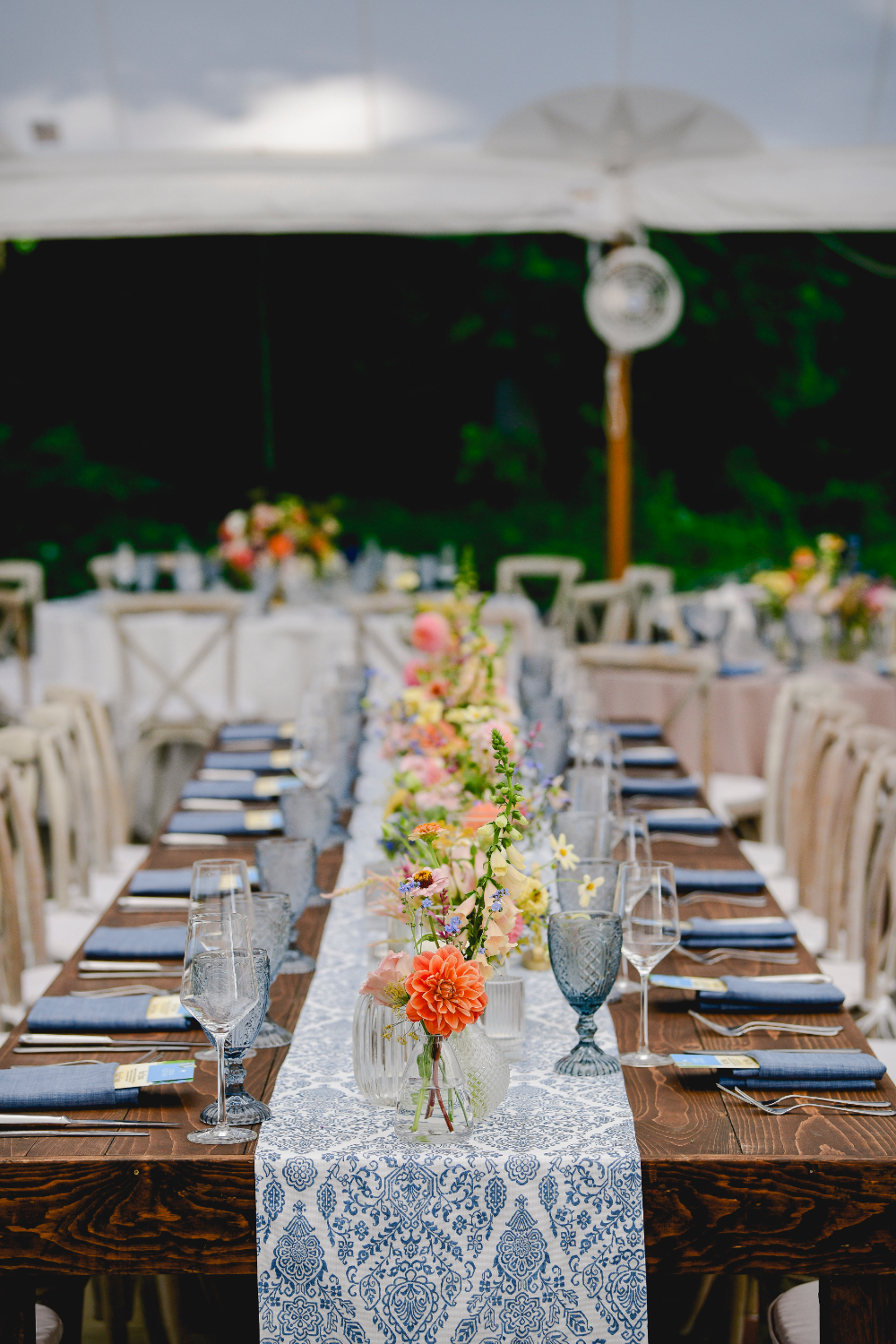 Refined table settings featuring pastel details at a Buttermilk Falls Inn wedding.