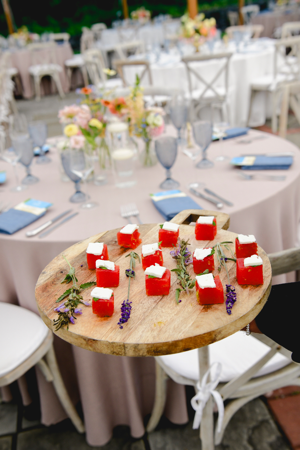Bite-sized appetizers served on wooden boards at a Buttermilk Falls Inn wedding.