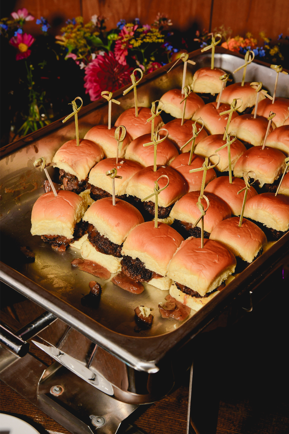 Mini sliders plated for guests at the wedding after party.